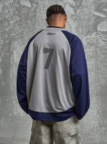 Maglietta varsity con stampa numerica e lettera, stile street americano oversize, maniche raglan, vestibilità ampia, patchwork blu navy e grigio