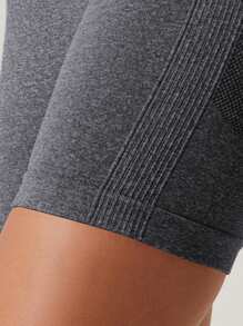 Pantalones cortos deportivos elásticos de un solo color y sin costuras que levantan el trasero, apropiados para correr, entrenar y hacer yoga