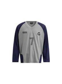 Maglietta varsity con stampa numerica e lettera, stile street americano oversize, maniche raglan, vestibilità ampia, patchwork blu navy e grigio