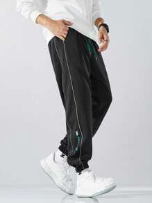 1 quần dài thường ngày dày dặn có dải phản quang cho nam, quần nỉ buộc mắt cá chân dáng rộng cho mùa thu/đông - màu đen - Xem 1