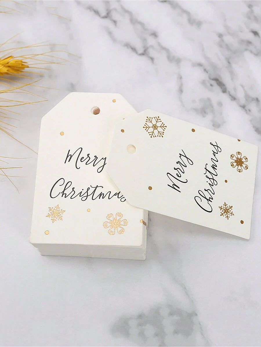 Set de 100 etiquetas con diseño de copos de nieve blancos que dicen "Feliz Navidad", adecuado para decorar cajas de regalo de Navidad - Multicolor - Ver 1