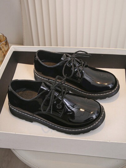 A Pair Of Children's British Style Small Leather Shoes For Spring And Autumn 2024 Versatile Retro Lace Up Flat Black Work Commuting Shoes