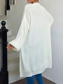 Cardigan élégant et unicolore avec épaules basses, col en V, coupe ample et ouverte sur le devant. Parfait pour la saison automne/hiver. - Nude - Voir 2