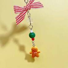 Thiết kế mới Phong cách Giáng sinh Nơ Colorblock Quà tặng ngày lễ Người bánh gừng Trang trí Giáng sinh Làm thủ công Hạt cườm Dễ thương Bùa hộ mệnh cổ điển, Dây đeo điện thoại, Mặt dây chuyền điện thoại - Dây buộc điện thoại di động hình người đàn ông bánh gừng giáng sinh - Xem 5