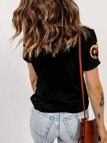 Camiseta de manga corta de cuello redondo con gráfico de calabaza de Halloween con lentejuelas