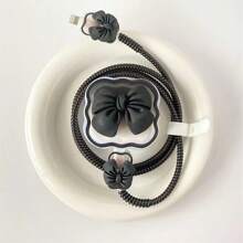 Custodia protettiva per caricabatterie standard britannico da 20 W, in morbida scocca con design a onde e fiocchi per proteggere il cavo compatibile con 16 Pro Max / 15 Pro Max