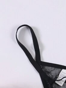 Tanga transparente y erótico de hombre con forma de O, de perlas y encaje calado de talle bajo