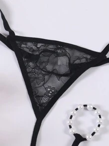 Tanga transparente y erótico de hombre con forma de O, de perlas y encaje calado de talle bajo