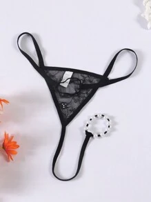 Tanga transparente y erótico de hombre con forma de O, de perlas y encaje calado de talle bajo