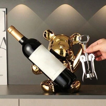 1 Stück bären-förmiger Tisch-Weinregal, Haushaltskera-mikmaterial Silber/Gold kreatives hochwertiges Weinregal (mit Flaschenöffner), haltbarer Tischplat-ten Weinschrank Dekoration, geeignet für Hauseingang, Esszimmertisch, TV-Schrank Dekoration, Wohnzimmer, Bar und Küche Aufbewahrung und Organisation, ein wertvolles Geschenk für Weinaufbewahrungs-Zubehör.