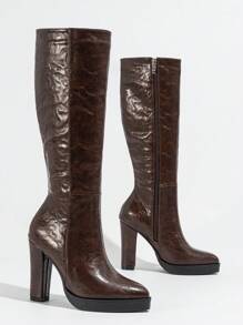 新款优雅简约高筒防水厚底侧拉链粗跟女靴，舒适时尚，适合秋冬季节，搭配黑色裙子或参加派对都非常合适。