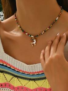 1 pieza Regalo de joyería navideña, colgante de collar de aleación de zinc y cuentas de colores con diseño de reno y hombre de jengibre para niñas fiesta de Año Nuevo - NM0142milu - Ver 1