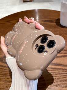 Custodia per telefono divertente a forma di orsetto di peluche con mela, custodia per telefono glitterata 3D a forma di orsetto carina, compatibile con 15 14 13 12 11 Pro Max, cover morbida in silicone con animale antishock e di stile - Castano - Visualizzare 1