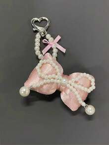 芭蕾风格珍珠蝴蝶结手机支架、钥匙扣、简约包包和耳机装饰，配有蕾丝蝴蝶结和透明垫 - 彩色 - 查看 2