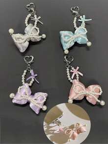 芭蕾风格珍珠蝴蝶结手机支架、钥匙扣、简约包包和耳机装饰，配有蕾丝蝴蝶结和透明垫 - 彩色 - 查看 9