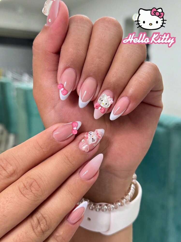 Sanrio Juego de 24 uñas postizas de almendra con decoración 3D de Hello Kitty linda con lazos y perlas, puntas francesas blancas, uñas acrílicas falsas de ajuste perfecto, incluye 1 gel de gelatina y 1 lima de uñas, uñas de Hello Kitty para mujeres y niñas para uso diario y fiestas, suministros de uñas
