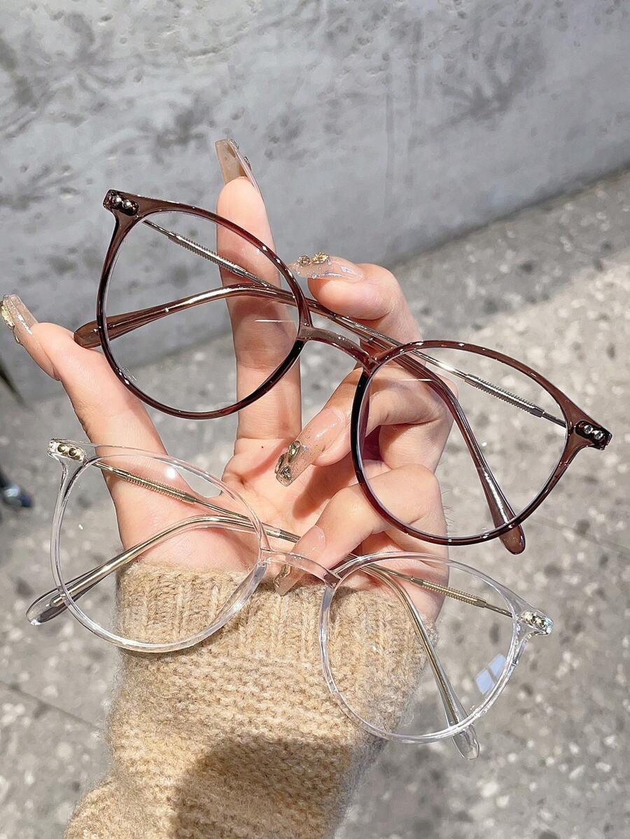 1副女士圆形日常休闲简约时尚透明镜片眼镜，适合外出、上学、通勤等场合。