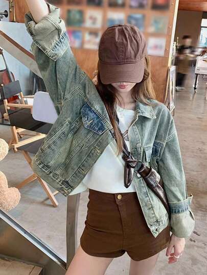 洗水蓝牛仔翻领长袖破洞夹克，女士休闲风格