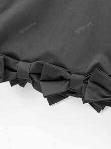 Chaqueta tipo blazer informal de longitud corta con decoración de lazo en el bajo