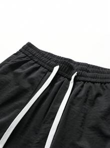 Pantalones cargo holgados de hombre unicolor con múltiples bolsillos, pantalones deportivos con cordón para uso en exteriores