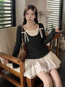 RUIWY 女士甜美蝴蝶结设计撞色长袖修身圆领毛衣，适合秋季穿着 - 黑色 - 查看 7