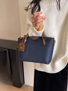 全新休闲女士尼龙手提包和单肩包，纯色饺子形斜挎包