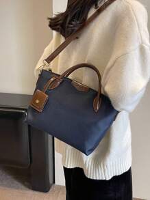 全新休闲女士尼龙手提包和单肩包，纯色饺子形斜挎包