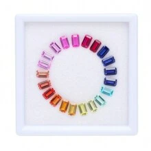 一盒（21 颗）实验室培育蓝宝石，用于制作高级珠宝制作材料组件。例如，手镯和项链均由材料制成。