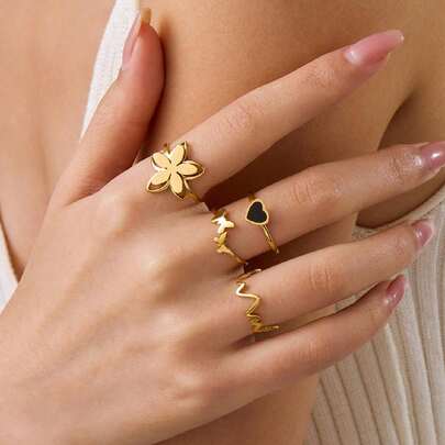 Set de 4 anillos de acero inoxidable con base negra en diseños de flor pequeña, mariposa, ECG y chapado en dorado, adecuado para uso diario o como regalo para el Día de la Madre, San Valentín u ocasiones especiales