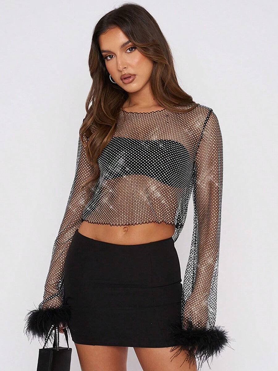 Blusa transparente de malla con top corto, camisa de manga larga con aplicaciones de strass y puños con plumas, color negro/rosa transparente - Negro - Ver 1