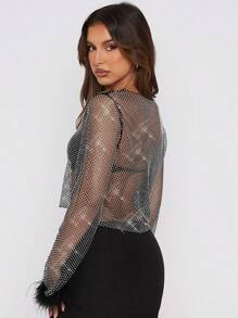 Blusa transparente de malla con top corto, camisa de manga larga con aplicaciones de strass y puños con plumas, color negro/rosa transparente - Negro - Ver 2