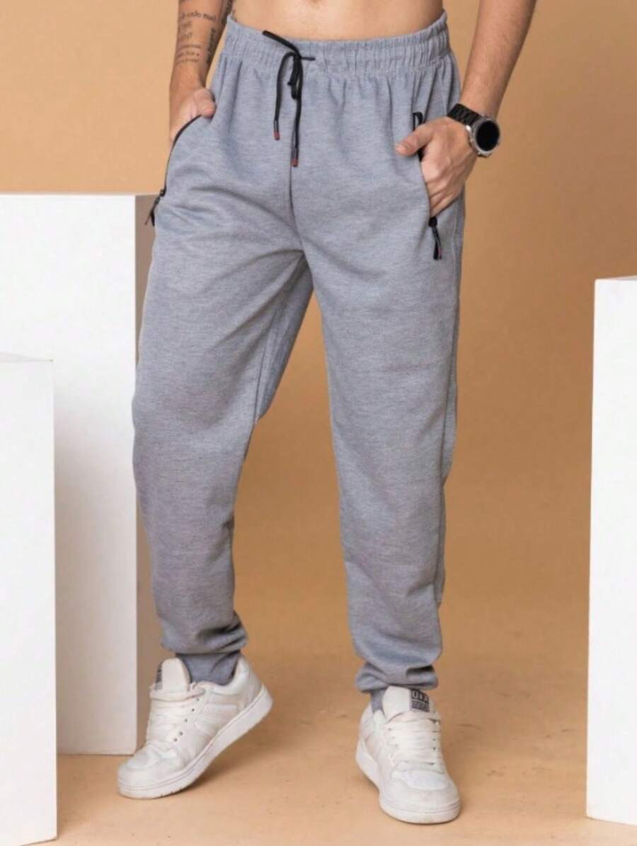 带前口袋和拉链的运动裤 - 灰色 - 查看 1