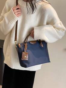 全新休闲女士尼龙手提包和单肩包，纯色饺子形斜挎包