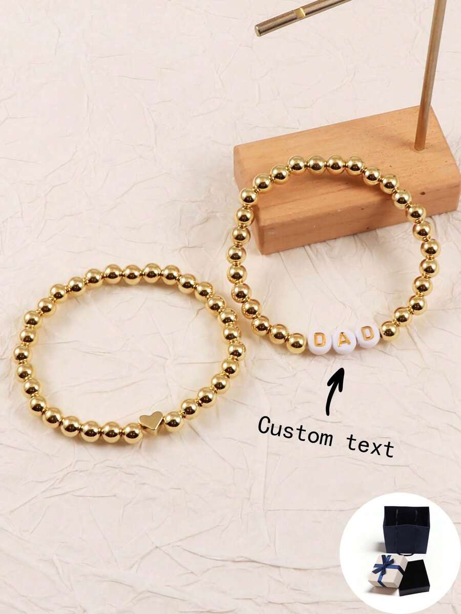 可定制优雅风格金色串珠手链套装，可堆叠字母珠，带有姓名/口号/专辑标题/音乐会支持个性化设计，适合生日、情人节、周年纪念日，送给女朋友、男朋友、朋友的礼物 - 橘色 - 查看 1
