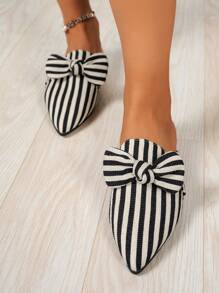 Mulas de mujer con puntera puntiaguda, diseño de rayas verticales con lazo, de uso casual, color negro y blanco, zapatillas planas versátiles para uso en interiores/exteriores, sueltas y relajadas, de moda, para primavera/otoño, Día de San Valentín