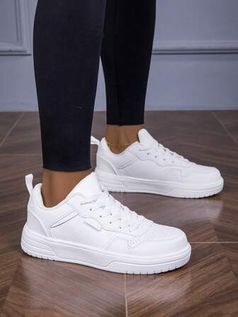 Unisex svarta och vita lapptäcksskor med andningsfunktion, bekväma låga snörskor för utomhusbruk, resor, fritid, minimalistisk stil