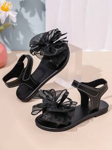 1 par de sandalias planas negras para niñas pequeñas con lazo transparente de malla, cierre de gancho y bucle, suela antideslizante, sandalias romanas lindas y elegantes, adecuadas para niñas de 3 a 12 años para uso diario, vacaciones y fiestas