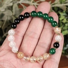 手工制作的手链，设计象征着富足和繁荣，男女皆宜。手链尺寸适中，由松紧带制成，配有 8 毫米黄水晶珠，用于平衡能量。这是一件完美的珠宝礼物。 - 彩色 - 查看 4