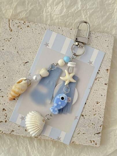 1 pieza Accesorio unisex hecho a mano con estilo oceánico, colgante de llavero con estrella de mar, pez pequeño