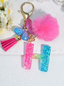 1 pièce Porte-clés en résine à lettres bicolores, pendentif de sac mode avec pompon à gland papillon, cadeau pour amis et école