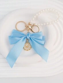 1 Mặt dây chuyền móc khóa trang trí bằng ngọc trai giả và nơ lớn thanh lịch, được trang bị thẻ treo ngọc trai hướng dương sáng tạo màu trắng, Phụ kiện thắt nút vải ruy băng cá nhân hóa nhiều màu sắc, Phụ kiện tai nghe và túi đựng điện thoại, Hoàn hảo làm quà tặng cho bạn thân - trắng - Xem 5