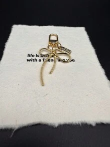 HAILIAN 简单而百搭的钥匙扣包包吊坠采用合金材料制成，适合女士，小巧，可作为送给好朋友的圣诞礼物，感恩节礼物，冬季女士礼物蝴蝶结 - 金色 - 查看 5