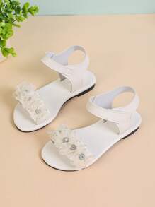 1 Đôi dép xăng đan đế bằng đính hoa giả cho bé gái, quai dán, mũi tròn, đế nhẹ chống trượt, phong cách La Mã dễ thương, thích hợp cho bé gái từ 3-15 tuổi, mặc hàng ngày và dự tiệc - Xem 4