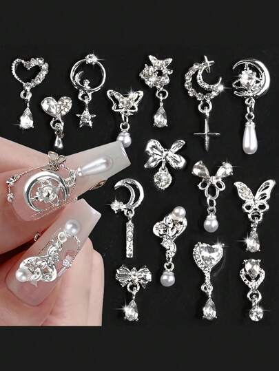 15 قطعة من الزينة المعدنية المطلية بالفضة على شكل قلوب وفيونكات للأظافر، قلادات على شكل نجوم وأقمار وشرابات لؤلؤية وكريستالات، زخارف وتميمات لأظافر ثلاثية الأبعاد بتصميم فراشات لامعة، إكسسوارات لتزيين الأظافر