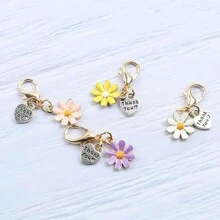 Set de 4 llaveros con dijes de margarita y corazón que dicen "Gracias por ayudarme a crecer" - Perfecto para agradecer a maestros, familia y amigos | Ideal para cumpleaños, graduaciones, bodas, accesorios escolares, accesorios góticos y de Y2K, ideas de regalo para el Día del Maestro, Navidad, accesorios para bolsos, portaidentificaciones, accesorios para autos - Multicolor - Ver 5