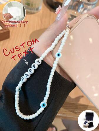 Anpassad telefonlina, moderiktig och personlig pärl- och onda ögon-telefonrem, kan anpassas med namn, slogan, plats, datum, lämplig som födelsedag, jubileumspresent eller tillbehör
