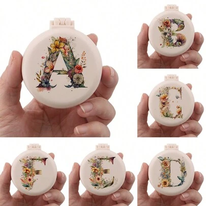 1个可爱26字母花卉婚礼专属迷你梳子，小巧便携迷你气垫梳，带折叠气囊按摩功能，内置镜子，旅行和露营必备