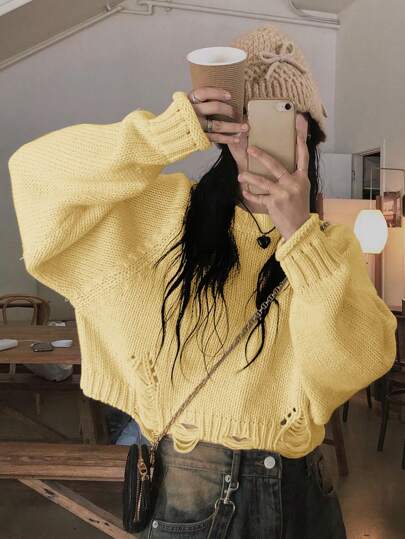 女士休闲时尚破洞针织黄色毛衣，独特设计