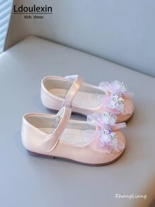 Nuove scarpe piatte con fondo morbido antiscivolo per ragazze con fiocco e design a strappo, stile principessa