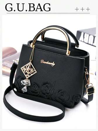 1 款简约刺绣女士手提包，花朵装饰，配有绒球字母吊坠，优雅时尚，可手提或肩背，适合通勤、逛街、购物、母亲节礼物、送给女朋友或闺蜜的礼物、情人节礼物